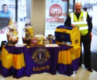 Lion Andy ready to sell you a ticket