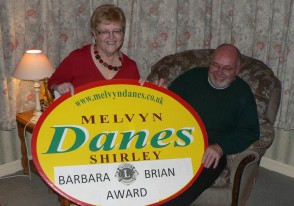 Melvyn Danes award presentation to Lions Brian and Barbara