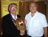 Lion President Jim presents the trophy to Lion John Garfield of Acocks Green Lions Club