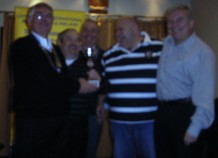 Lion President Jim presents the trophy to the Solihull Moors FC team